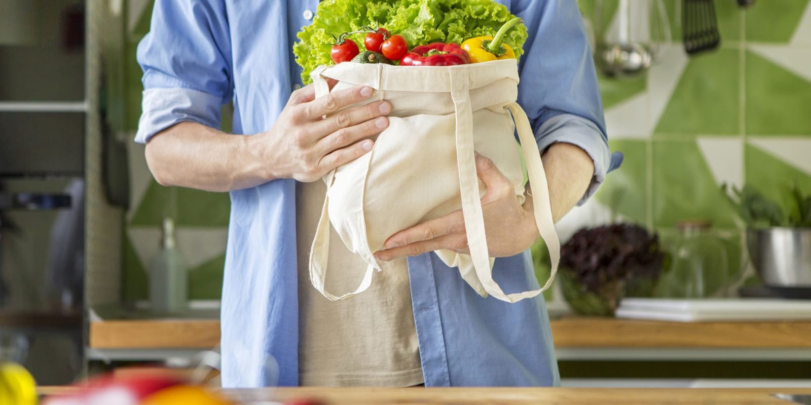 Vegetables for whole family. Man vegetarian planning to cook healthy vegetable salad of fresh products at home